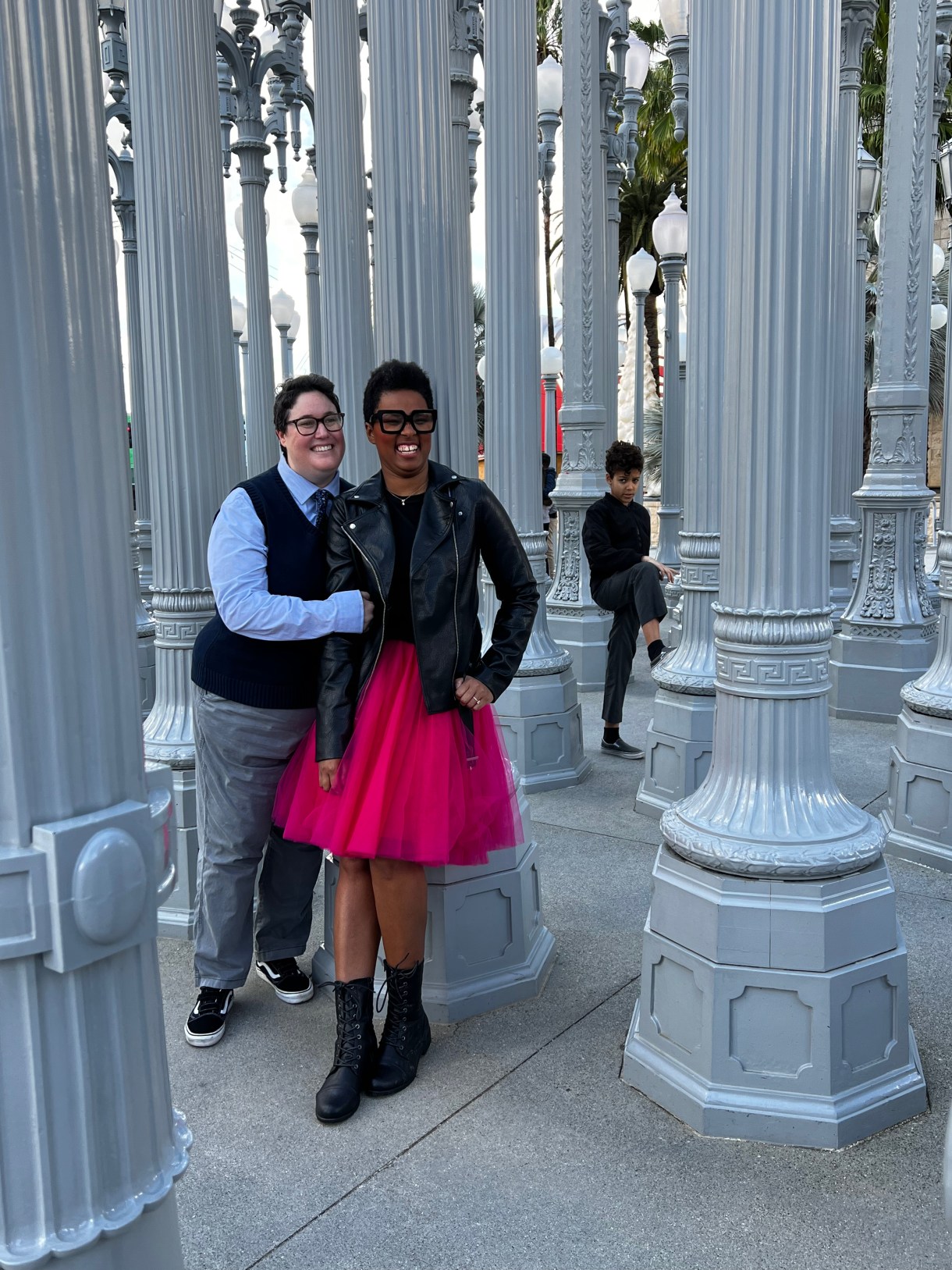 The author (a black woman with short hair) and her wife (a white butch with brown hair) pose on their wedding day.