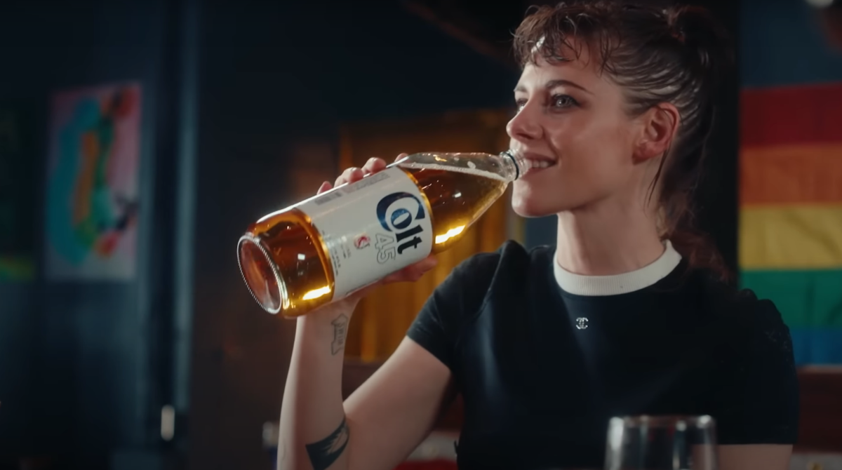 Kristen Stewart drinking from a COLT 40