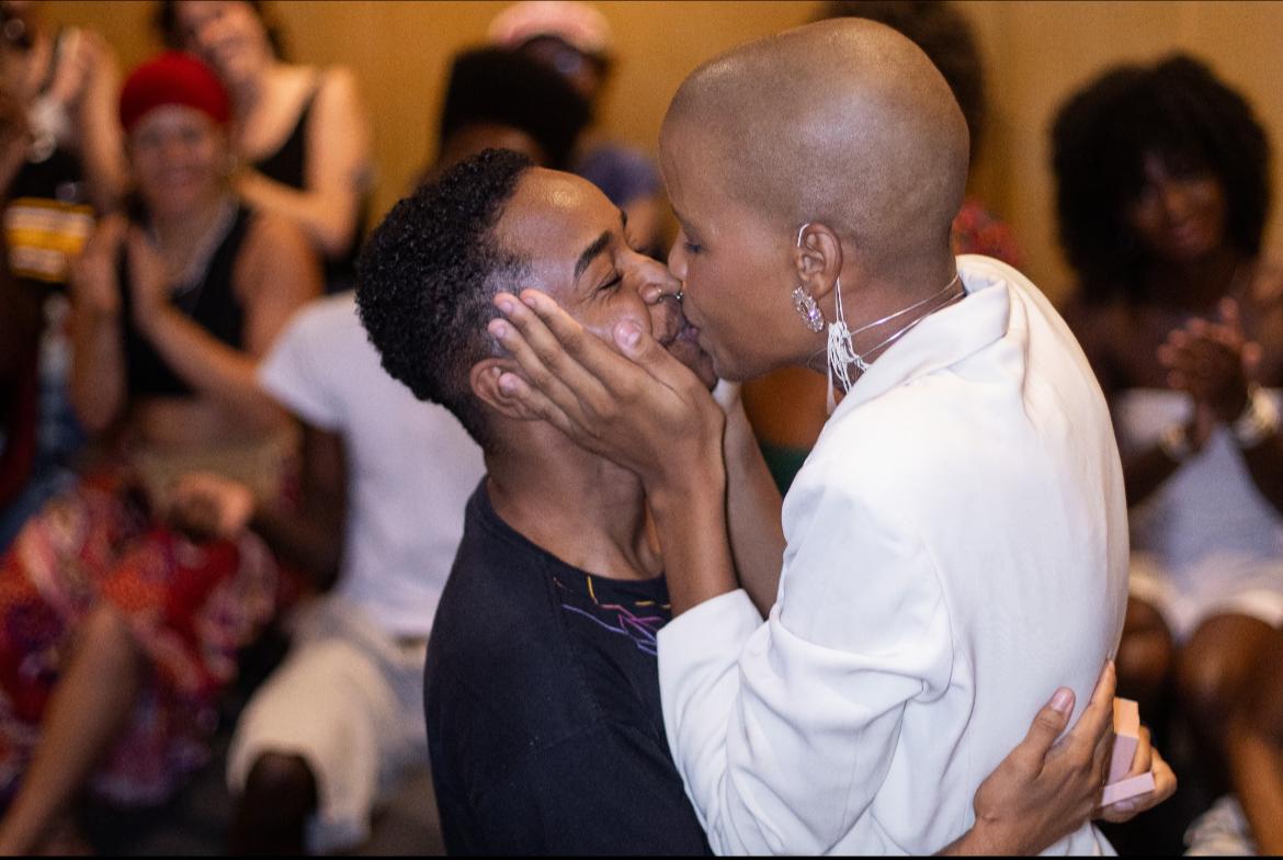 Ayo (right) and their partner, moments after the wedding proposal. “Do Outro Lado da Ponte” Ball in Niterói, Rio de Janeiro, January 2024.