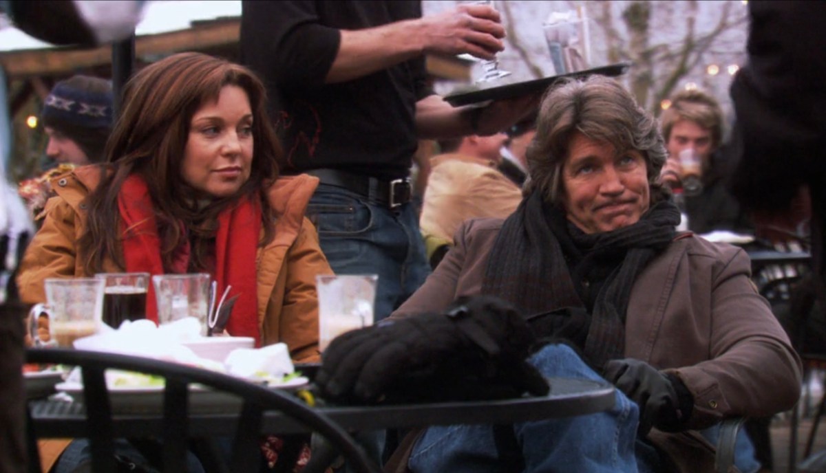 gabe and his wife sitting outside at the ski resort 