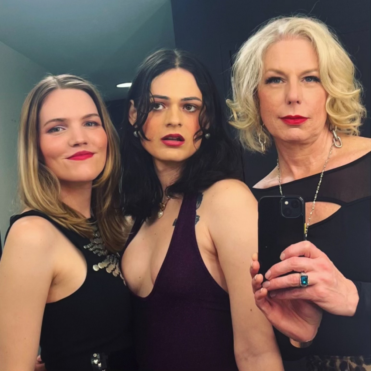 Murphy, Carmen, and Lisa pose in a mirror selfie shot by Lisa.