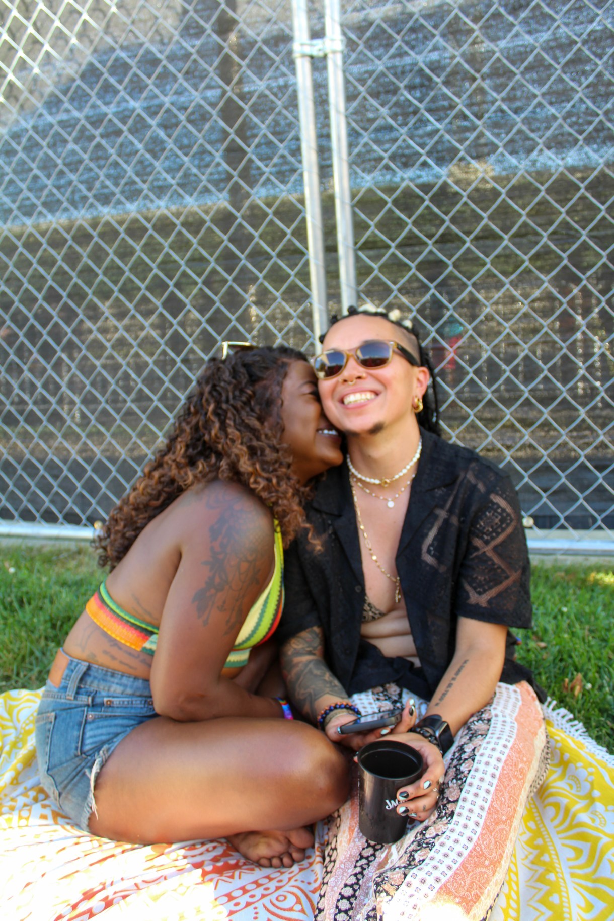 Two people cuddling outside at Kentuckiana Pride before the Chappel Roan concert