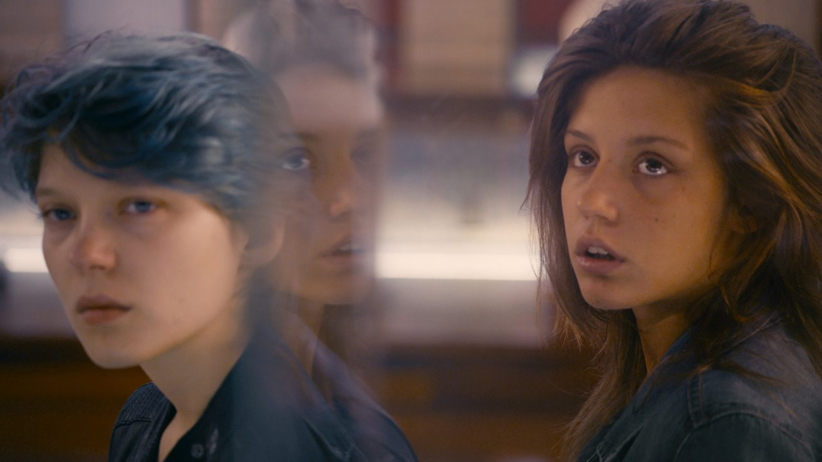 Lea Seydoux and Adele Exarchopoulos look at art.