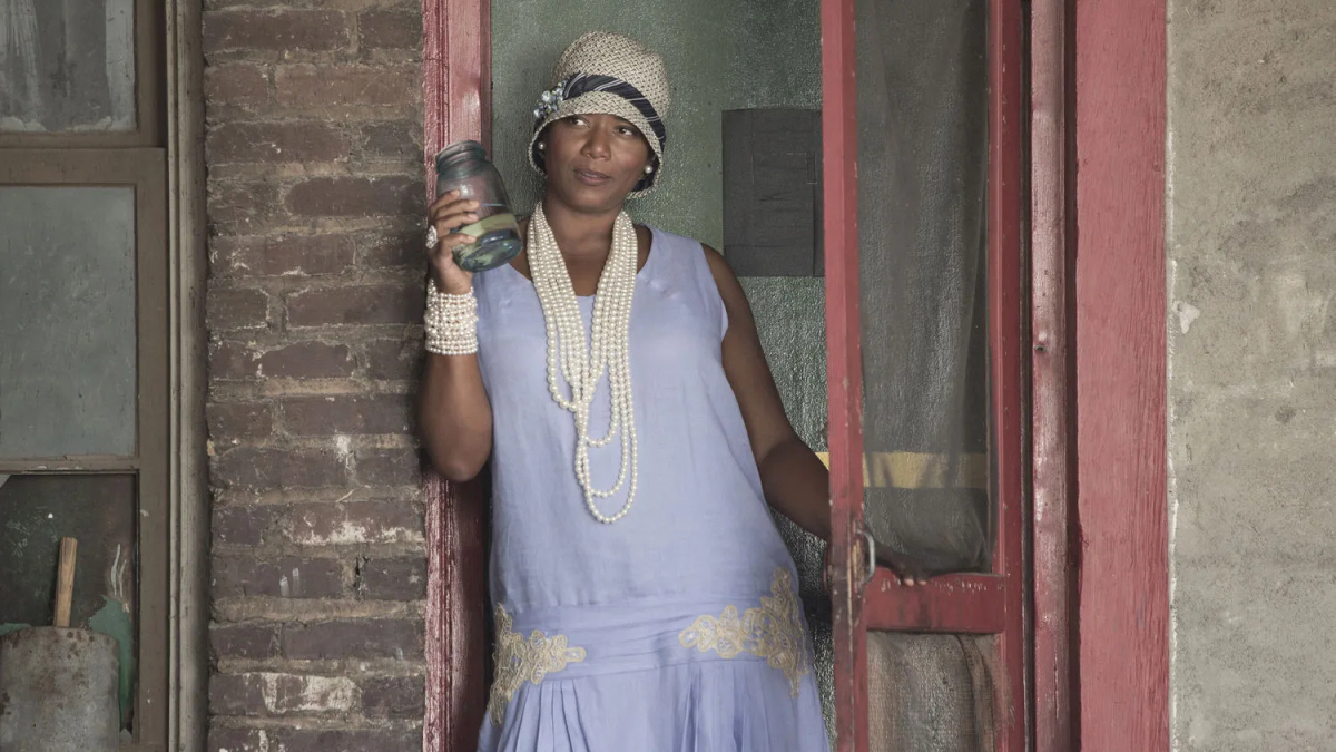 Queen Latifah as Bessie Smith leans against a wall.