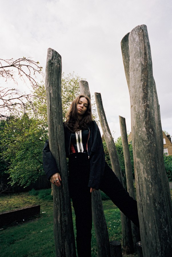 Minke stands posed among some logs