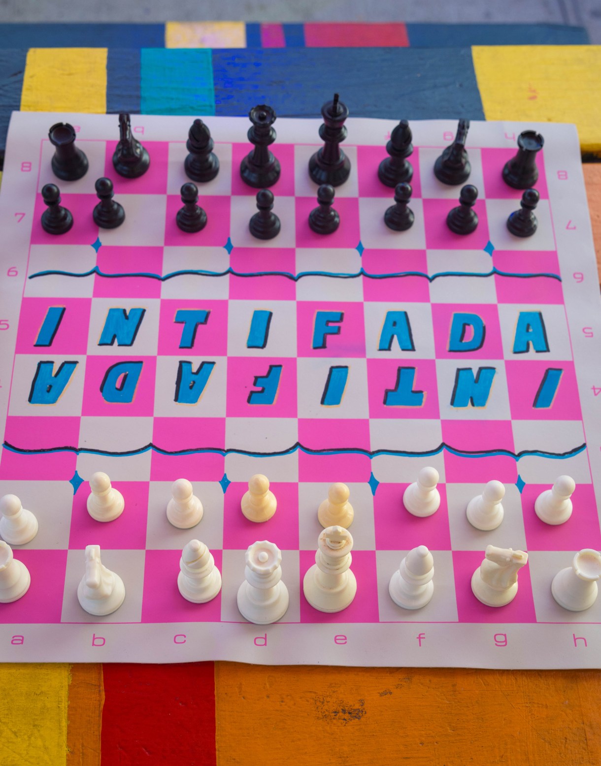 a chess board that reads INTIFADA