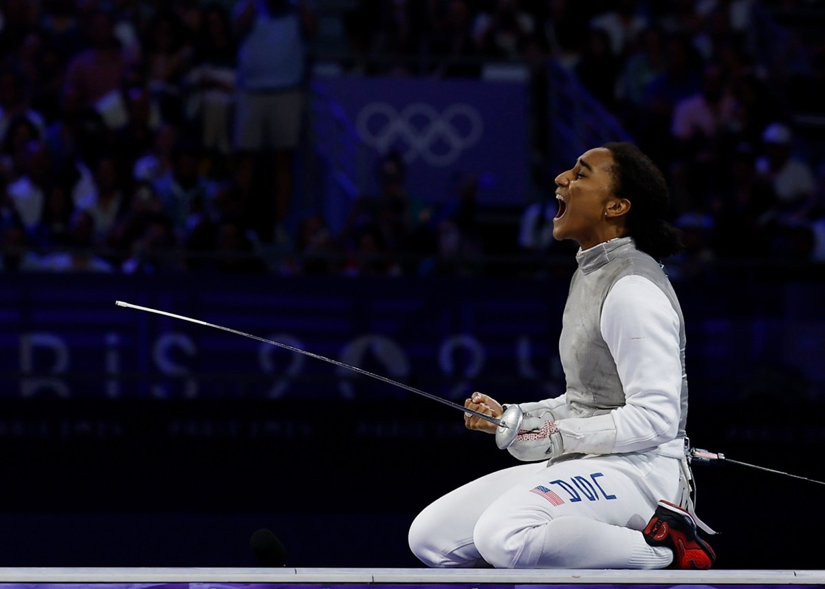 Lauren Scruggs of USA celebrates after defeating Arianna Errigo not shown in picture of Italy during the women's foil team gold medal match of fencing between Italy and USA at the Paris 2024 Olympic Games in Paris, France, Aug. 1, 2024. (Photo by Fei Maohua/Xinhua via Getty Images)