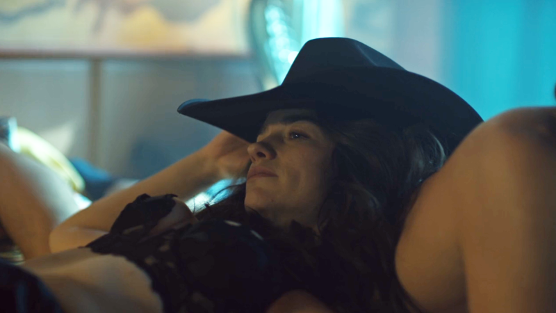 Wynonna Earp Vengeance: wynonna slumps down in Doc's hat 