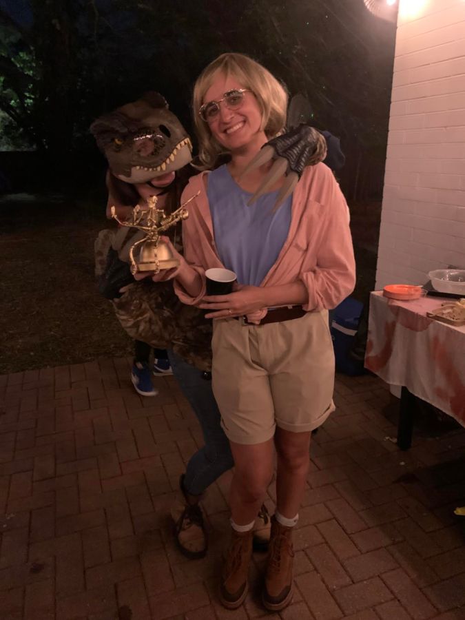 Kristen Arnett dressed as a T-Rex and Kayla Kumari Upadhyaya dressed as Ellie Sattler