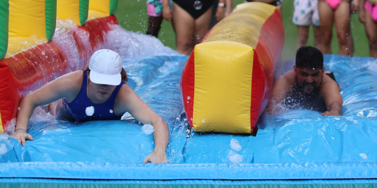 two queer people on a slip n slide