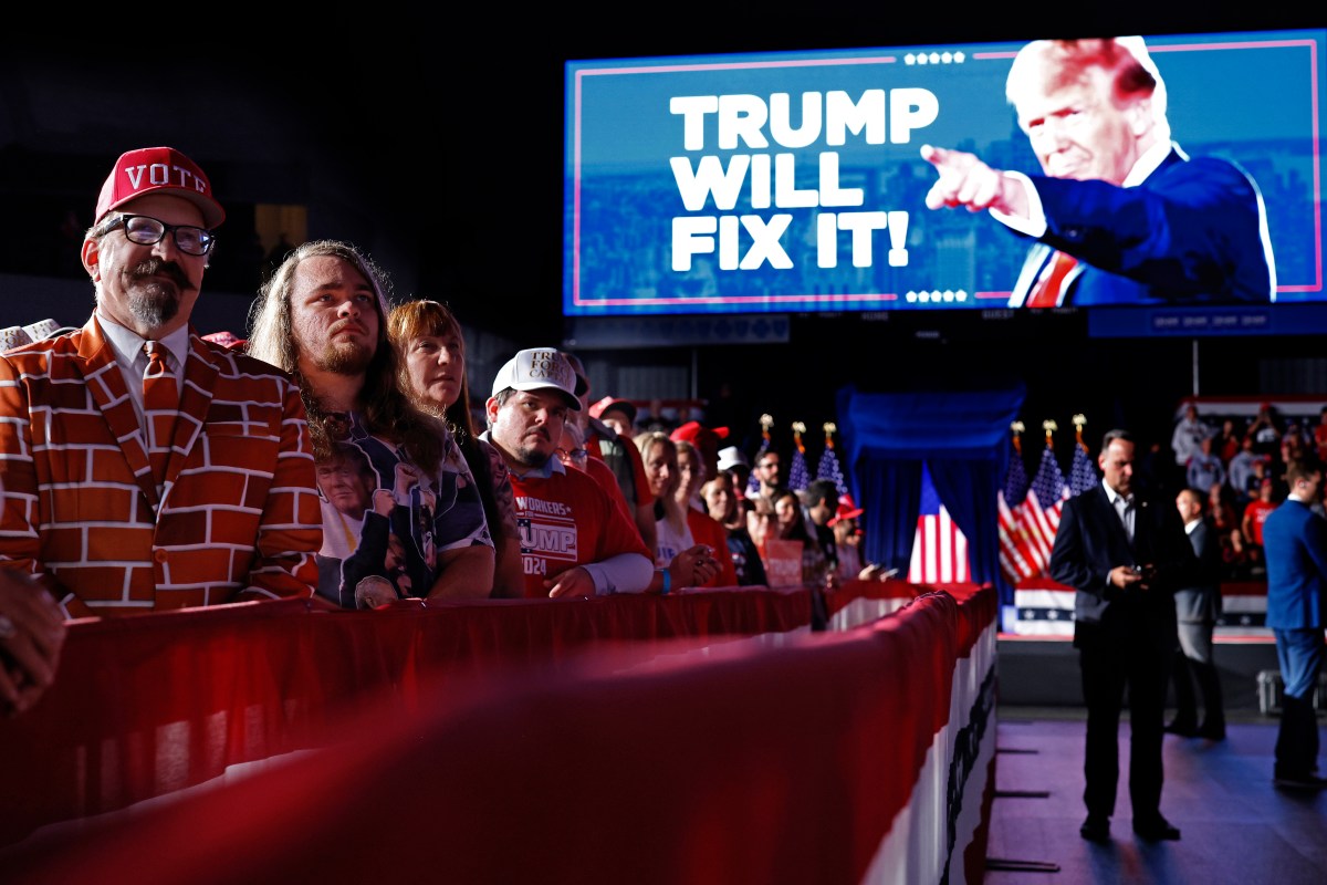 GRAND RAPIDS, MICHIGAN - NOVEMBER 05: Supporters listen to Republican presidential nominee, former President Donald Trump during his last campaign rally at Van Andel Arena on November 05, 2024 in Grand Rapids, Michigan. Trump campaigned for re-election in the battleground states of North Carolina and Pennsylvania before arriving for his last rally minutes after midnight in Michigan. (Photo by Chip Somodevilla/Getty Images)