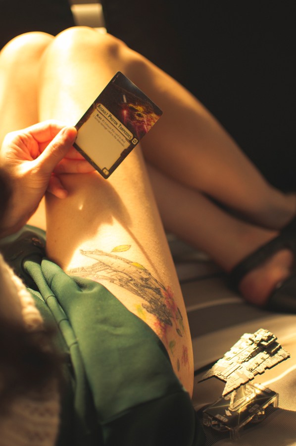 a person holding a playing card