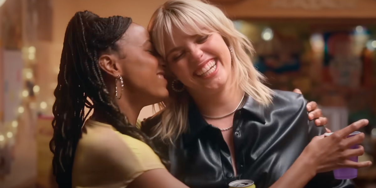 Renee Rapp smiles and leans her head against Alyah Chanelle Scott in The Sex Lives of College Girls season three