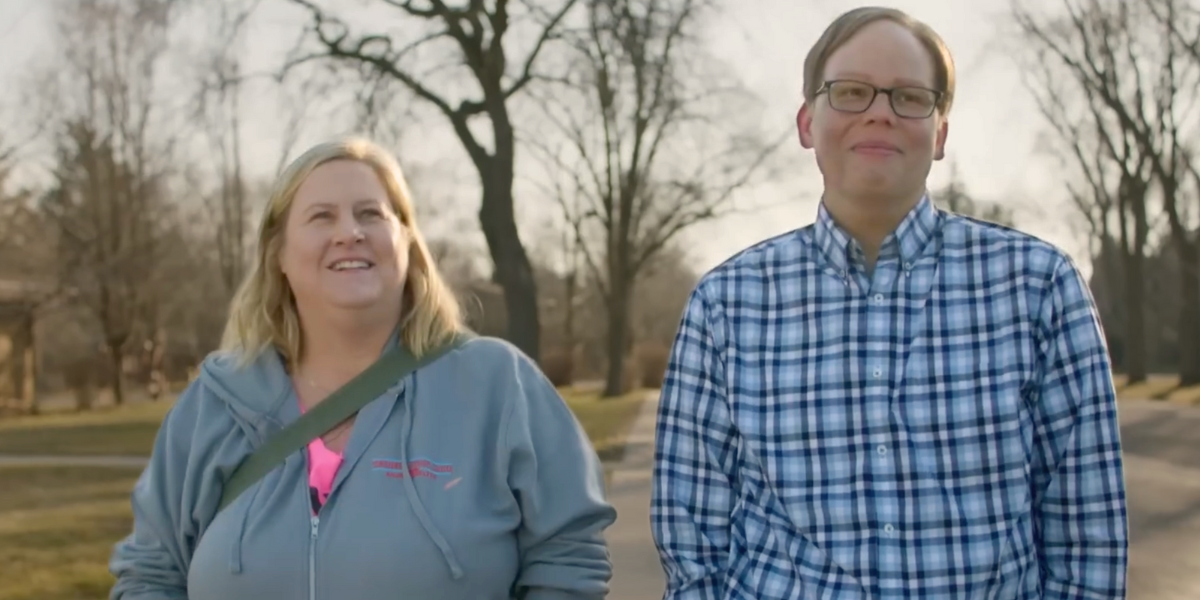 Bridget Everett and Jeff Hiller stand next to each other smiling in season three of Somebody Somewhere