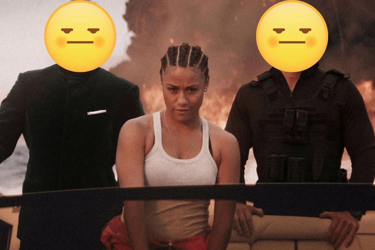 Ariana DeBose in a white tank top and corn rows pilots a boat with two men on her side but their faces have emojis over them.