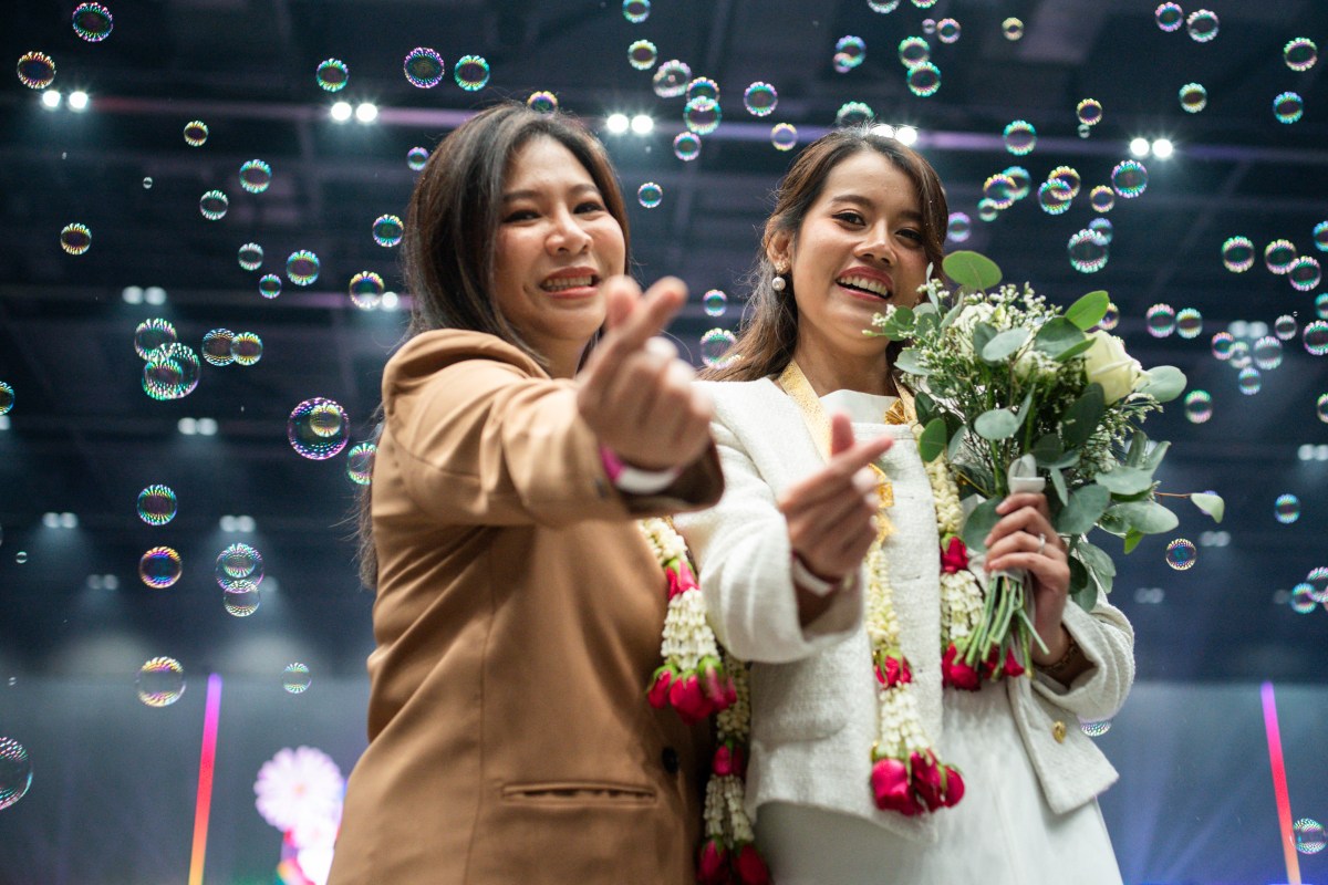 Atchima pornmuktra (L) and Wipanee nonthamarn (R), a same-sex couple, pose during their marriage registration event at Paragon shopping mall in Bangkok on January 23, 2025. A high-profile gay couple married in Thailand on January 23 as the kingdom's same-sex marriage law went into effect, an AFP journalist saw, among the first of hundreds expected to do so. (Photo by Chanakarn Laosarakham / AFP) (Photo by CHANAKARN LAOSARAKHAM/AFP via Getty Images)