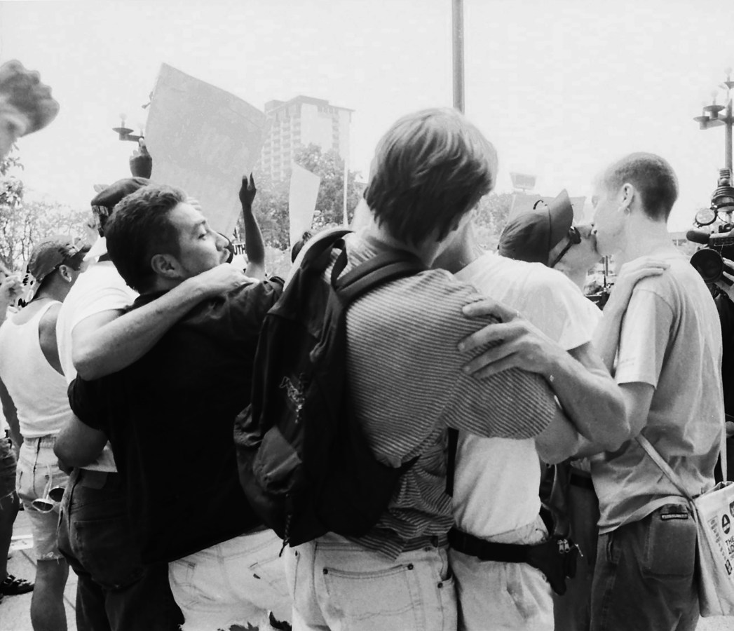 HOUSTON- August 18: 1992 Republican National Convention Protests. Queer Nation and ACT UP (AIDS Coalition to Unleash Power) activists by the political action of kissing in public, protest the Republican Party, anti-gay policies of the Catholic Church, anti-gay policies of the U.S. military, and the American government's negligence in the AIDS crisis at the Mickey Leland Federal Office Building on August 18, 1992 in Houston, Texas. (Photo by Lindsay Brice/Getty Images)