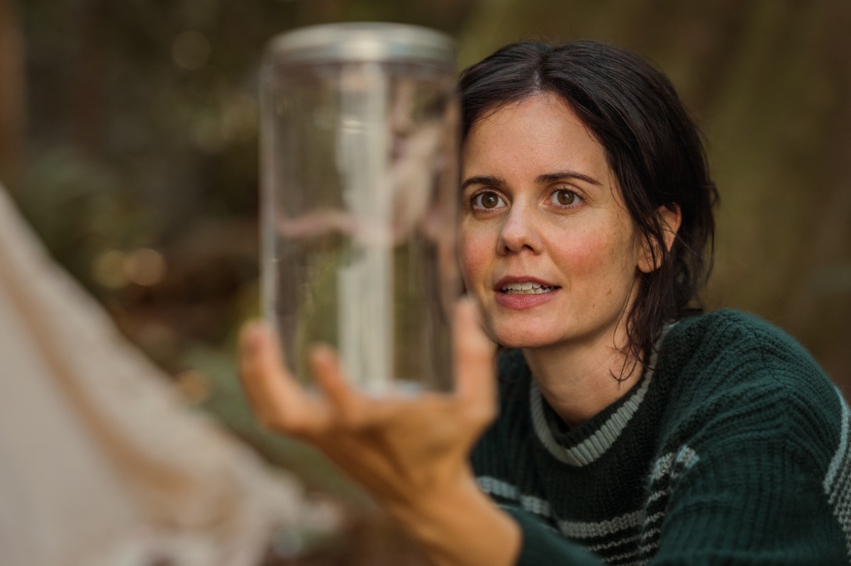 Hannah with a frog specimen in Yellowjackets