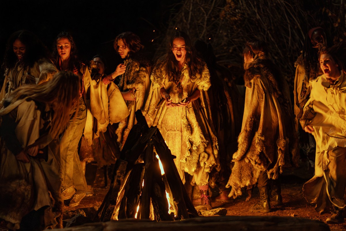 Lottie and the others screaming around a fire in Yellowjackets 306