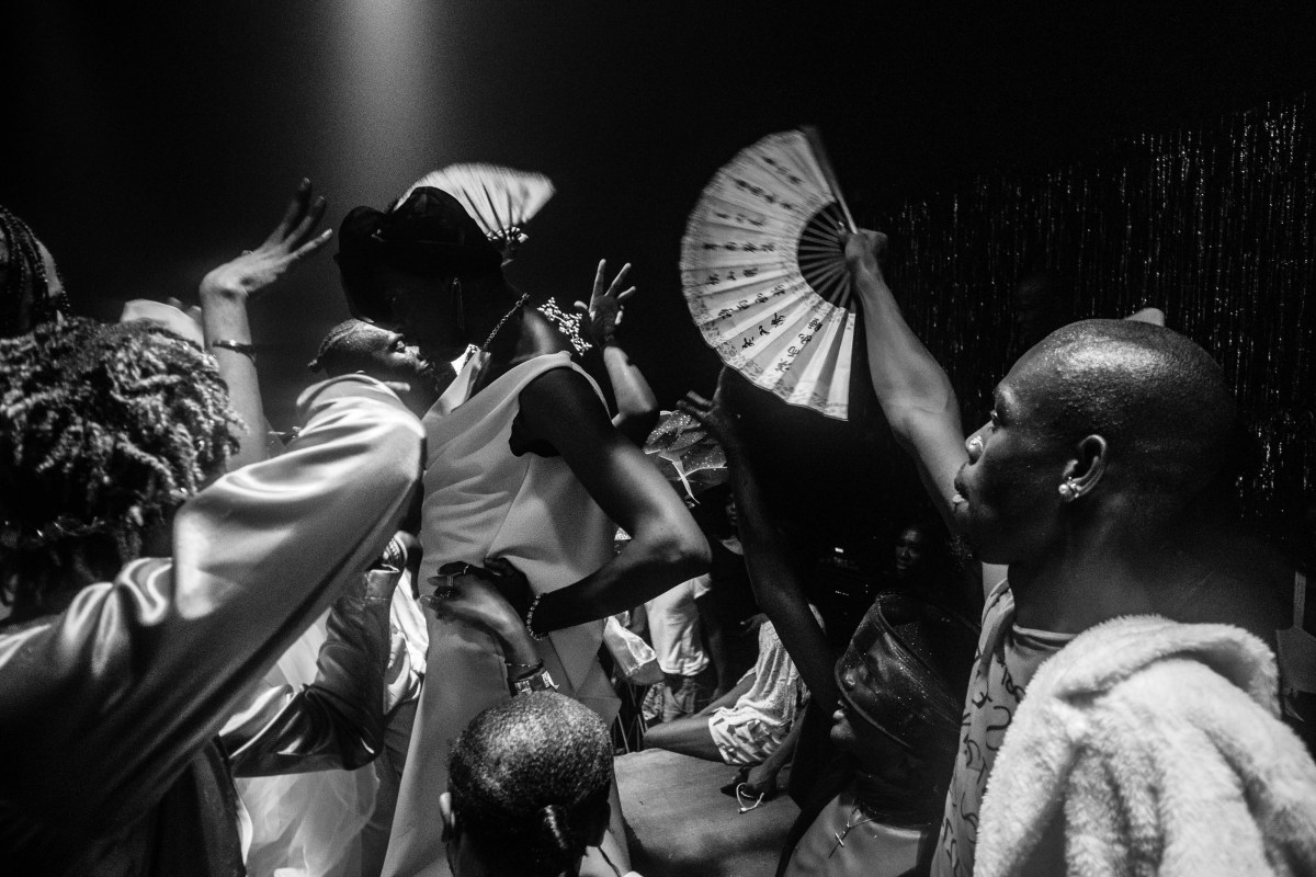 Heavenly Bodies performers and spectators with a fan at the ballroom