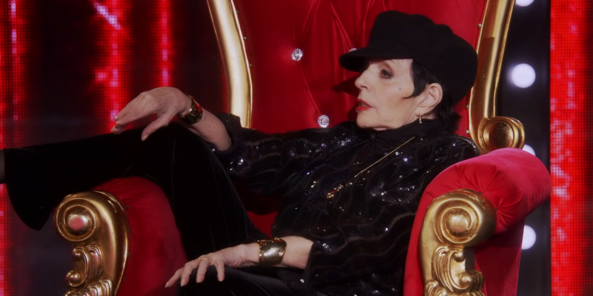RuPaul's Drag Race season 17 finale: Liza Minnelli sits with one leg up in a big throne like chair.
