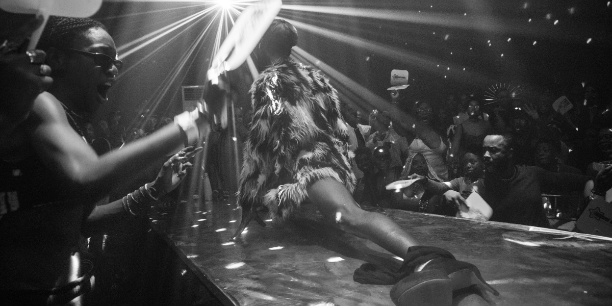 a ballroom performer striking an elegant split pose in Lagos