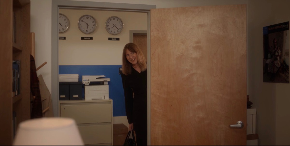 joy leaning across the door