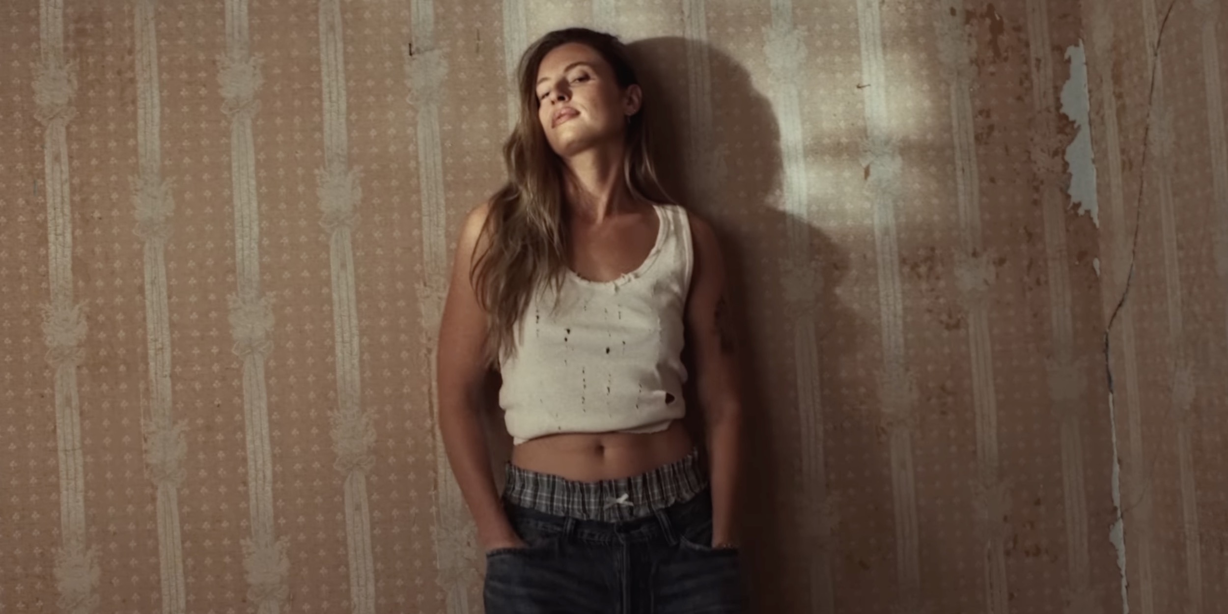 fletcher leaning on the wall