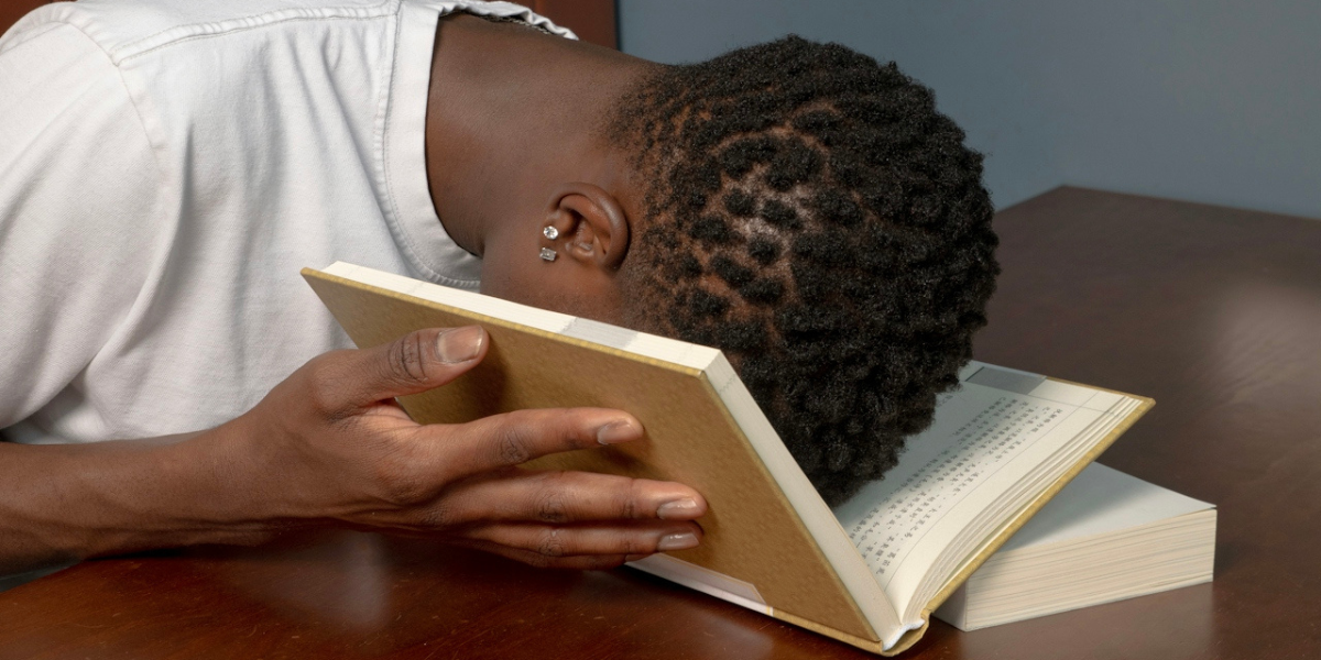 a woman with her face in a book