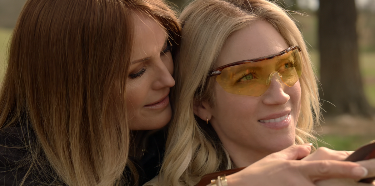 Margo and Sophie in The Hunting Wives with a gun