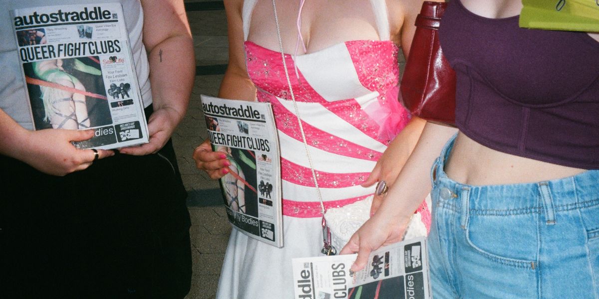 a bunch of queers holding The Autostraddle Insider, a new zine