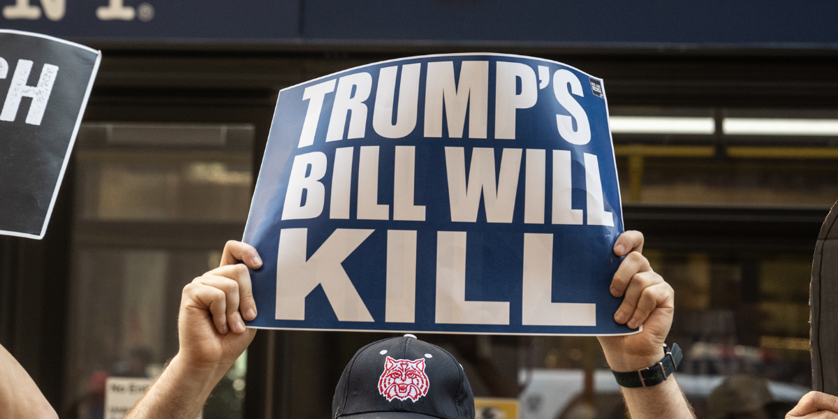 a protest sign that says TRUMP'S BILL WILL KILL