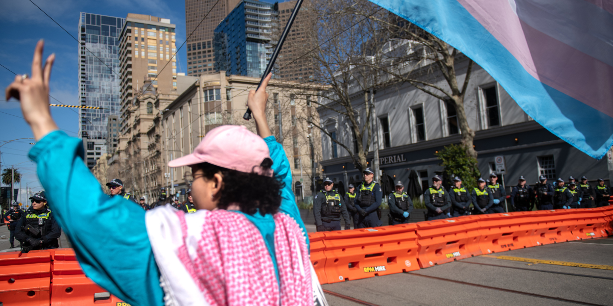 a person carrying a trans flag