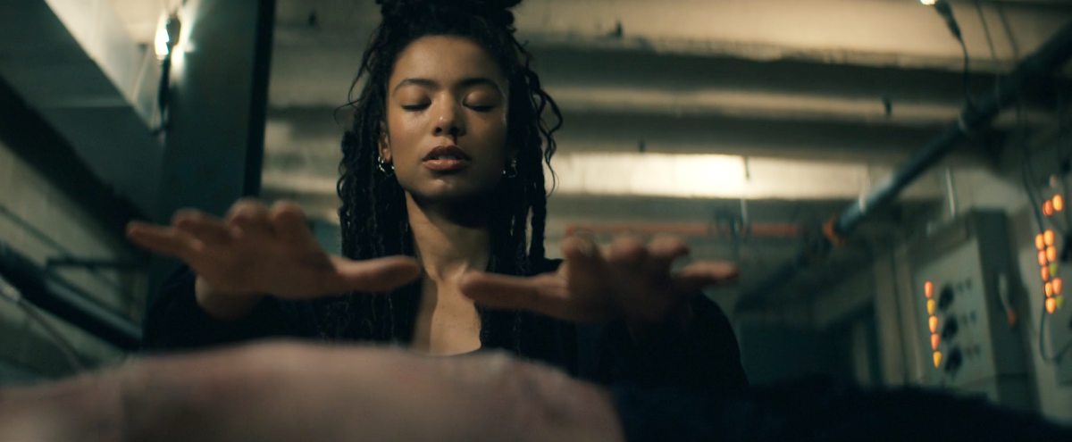 Gen V 207-15 marie stands over godolkin with her eyes closed, hands out, and blood running from her nostril